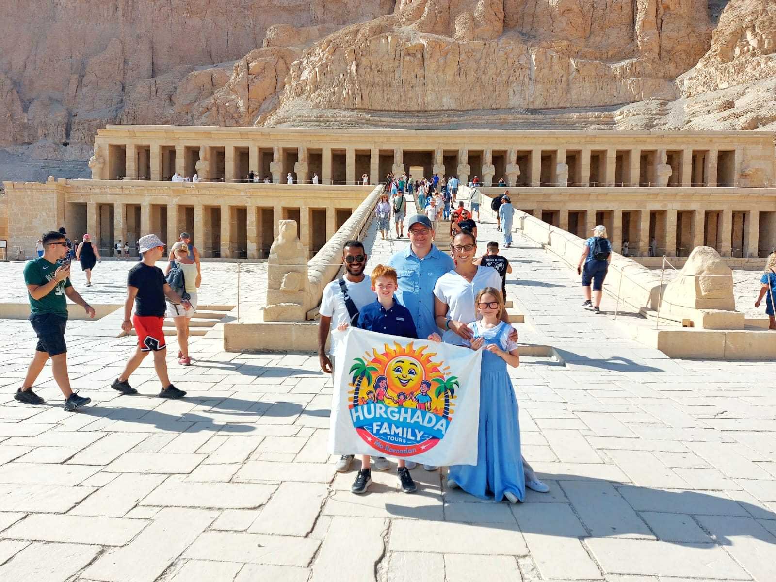 Hurghada Family Tours flag at Hatshepsut Temple Luxor