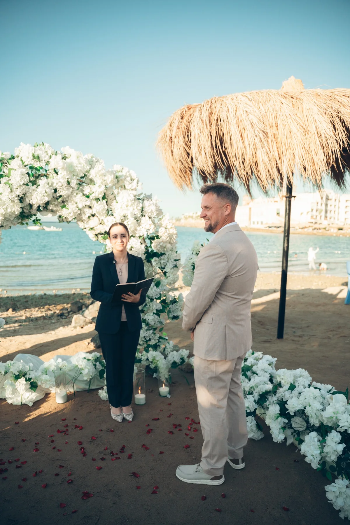 Wedding celebrant during Red Sea beach ceremony Hurghada